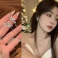 Close-up of elegant zircon bow tassel earrings and matching necklace set - Bowknot Zirconia Tassel Earrings (A1690) / Silver