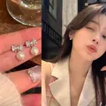 Exquisite silver bow earrings featuring sparkling zircon and elegant white pearl drops - Bowknot Pearl Pendant Style (A1405 Silver)