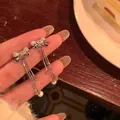 Elegant silver zircon bowknot earrings featuring long tassels with pearl accents - Rhinestone Bow Tassel Artificial Pearl Style (A1403银)