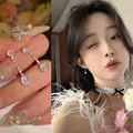 Elegant Korean style zircon drop earrings shown on model with floral background - Vertical Linear Tassel Stud Earrings (A1592) / Silver