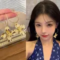 Elegant gold Korean style irregular flower drop earrings with shiny textured petals - Hoop Wrinkled Flower Drop Style (A2067 Gold) / Gold
