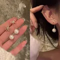 Elegant gold-tone zircon bow tie earrings with delicate hanging white pearl drops for women - Bowknot Pearl Tassel Style (A1918 Silver) / Silver