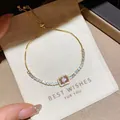 Elegant adjustable gold zircon bracelet with a central pink gemstone on a gift card - Rectangular Pink Zirconia Style (S847金) / Gold
