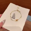 Elegant gold chain bracelet featuring a dainty brown butterfly charm and white pearls - Enamel Butterfly Artificial Pearl Style (S835金) / Gold