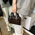 Vintage dark brown glossy handbag with cute sports charms, stylish square shoulder bag - With Pendant / Coffee