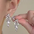 Elegant silver tassel earrings with sparkling flower crystals and S925 silver needle. - Rhinestone Flower Tassel Style (E6278) / Silver