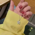 Elegant silver four-leaf clover pendant necklace with shimmering crystals for women - Four-Leaf Clover Heart Pendant (X446)