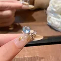 Sparkling silver-tone ear cuff featuring a large light blue zircon and clear stone accents - Blue Zirconia Style (A1916蓝)