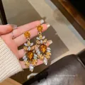 Dangling floral earrings featuring amber and iridescent crystals in a gold finish - Amber Rhinestone Flower Tassel Style (A2133) / Gold