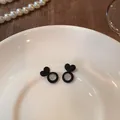 Black heart-shaped silicone earring backs for stabilizing studs on a white plate - Heart Support Style (ED001) / 1 Piece / Black