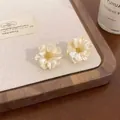 Elegant cream floral stud earrings featuring a pearl-like luster and golden core - 立体珍珠花蕊花朵款(A2244) / 奶白色配黄色