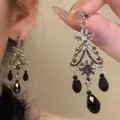 Close-up of vintage silver chandelier earring with black teardrops and sparkling crystals. - Vintage Chandelier Teardrop Style (A2389) / Black