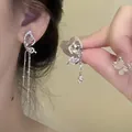Detail view of exquisite asymmetric butterfly tassel earrings with sparkling crystals - Asymmetric Butterfly Tassel Style (A1249)