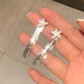 Fashionable sparkling star tassel earrings with rhinestones in silver finish - Star Tassel Style (A1519)