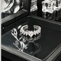 Detailed macro view of heart-shaped crystal open ring inside a black luxury jewelry box - No. 1 Open Ring (Heart Full Diamond)