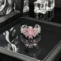 Close-up detail of a silver open ring with a pink crystal flower and pavé band - No. 3 Open Ring (Pink Zirconia Flower)