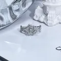 Close-up macro view of sparkling floral pavé ring with intricate silver band detailing - Twisted Band Pavé Four-Leaf Clover Style / Silver