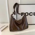 Large capacity brown leather hobo bag for women in minimalist studio setting - No Pendant / Coffee