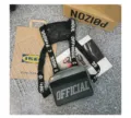 Detail view of a grey hip-hop tactical chest bag with OFFICIAL print and straps. - Gray