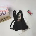 Tactical techwear chest bag in black featuring multiple pockets for streetwear style - Black