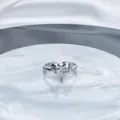 Detailed view of an elegant silver-toned heart-shaped open ring with sparkling pavé crystals - Style 5 Heart Main Stone / Adjustable Open