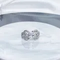 Detailed close-up of a silver bow-shaped open ring fully set with sparkling cubic zirconia - Style 1 Bowknot Full Diamond / Adjustable Open