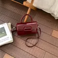 Chic dark red square handbag with large buckle detail and adjustable crossbody strap - No Pendant / Red