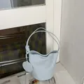 Large capacity light blue bucket bag with knotted shoulder strap and round charm - Shoulder Bucket Bag (With Pouch) / Blue