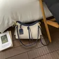 Bolso bandolera de lona y cuero azul marino para mujer, perfecto para el uso diario. - L / Azul