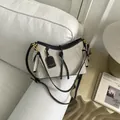 Elegante bolso de hombro en lona beige con ribetes de cuero negro y detalles dorados - L / Negro