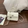 Elegant cream-white small square handbag with silver clasp and metallic heart charm - With Pendant / White