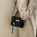 Elegant black small square crossbody handbag with silver hardware and chic heart charm - With Pendant / Black