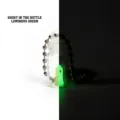 Detail view of luminous 3D printed ghost in a bottle keychain showing glow effect - Luminous Green