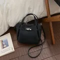 Classic black textured leather bucket bag with retro metal clasp and crossbody strap - Black without Pendant