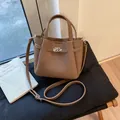 Vintage brown lychee grain leather bucket bag with silver turn-lock closure and strap - Brown No Pendant