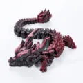 3D printed articulated dragon ornament in dark red finish close up view - 30cm / Dark Black Red