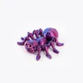 Detailed macro view of 3D printed spider toy in laser purple with articulating joints - S / Laser Purple