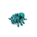 Macro detail of 3D printed articulated spider figurine in metallic laser green finish - S / Laser Green