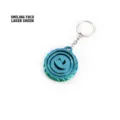 Nahaufnahme eines 3D-gedruckten Fidget-Spinner-Schlüsselanhängers in Lasergrün Blau - Smiley / Laser Grün