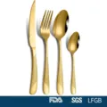 Detailed view of 4-piece gold stainless steel cutlery set with textured handles. - Gold / 4 Pieces