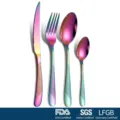 Close-up detail of a rainbow iridescent stainless steel cutlery set featuring a knife, fork and spoons - AB Color / 4 Pieces