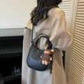Chic black pebbled leather bucket bag with a cute bear charm for women - Black with Charm