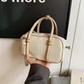 Elegant cream minimalist mini pillow bag with tan handles and an adjustable strap - 白配卡其标准款 / White & Khaki