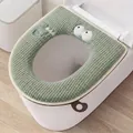 Soft green waffle-knit toilet seat cover featuring a cute monster face design with handle - Blue Eye with Lashes / Green