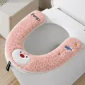 Soft pink plush U-shaped toilet seat cover featuring a cute cartoon penguin design - Little Penguin Style / Pink