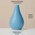 Modern blue ceramic bud vase for minimalist home decor and elegant floral arrangements - Blue