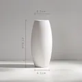 Modern minimalist white ceramic vase with dimensions 21.3cm height and 8.1cm width - Oval Shuttled Style (Taia)