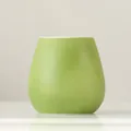 Small modern lime green ceramic vase with elegant matte textured finish for minimalist home decor - Green