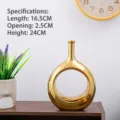 Moderner minimalistischer goldener kreisförmiger hohler Keramikvase für Wohndekorationen - Jade-Ring mit vergoldeter Mitte