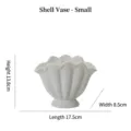 Small white ceramic shell-shaped decorative vase measuring 13.8cm high and 17.5cm long - S